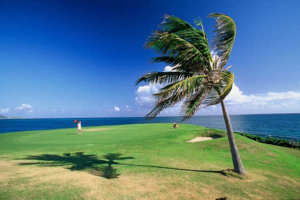  18hole courses with a white sand beach and turquoise sea in your view 